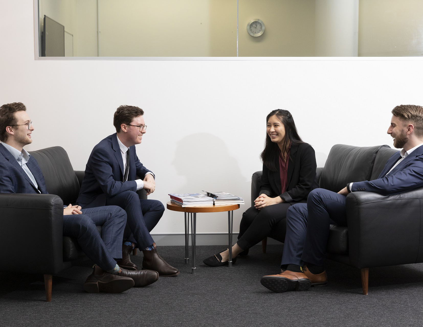 DIO mission assurance staff talking in a group