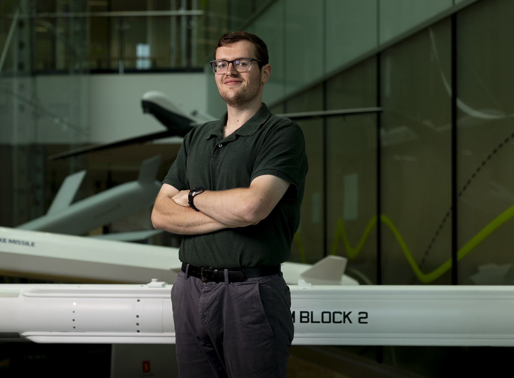 DIO Scientific Intelligence Analyst standing with arms folded