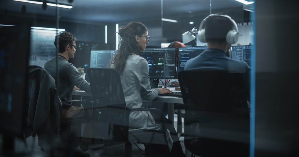 DIO Defence Graduates working on computers
