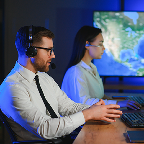Two AGO analysts looking at maps
