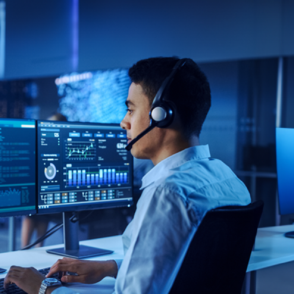 AGO Analyst at a computer