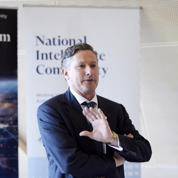 The Director-General of National Intelligence speaking at a symposium