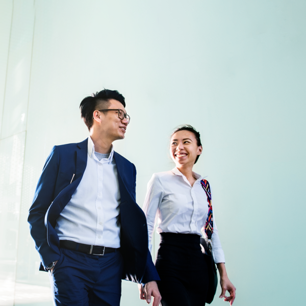 Young professional people walking to work