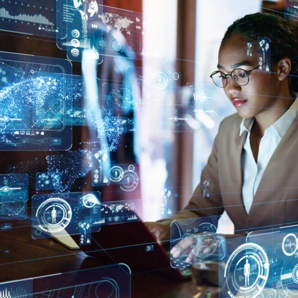 DIO STEM graduate in engineering working on a computer