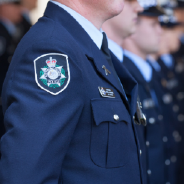 Uniformed officers standing in line 