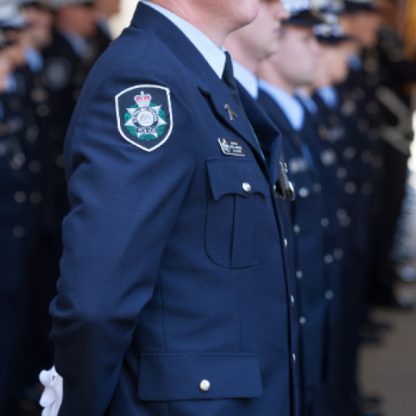 Uniformed officers standing in line 